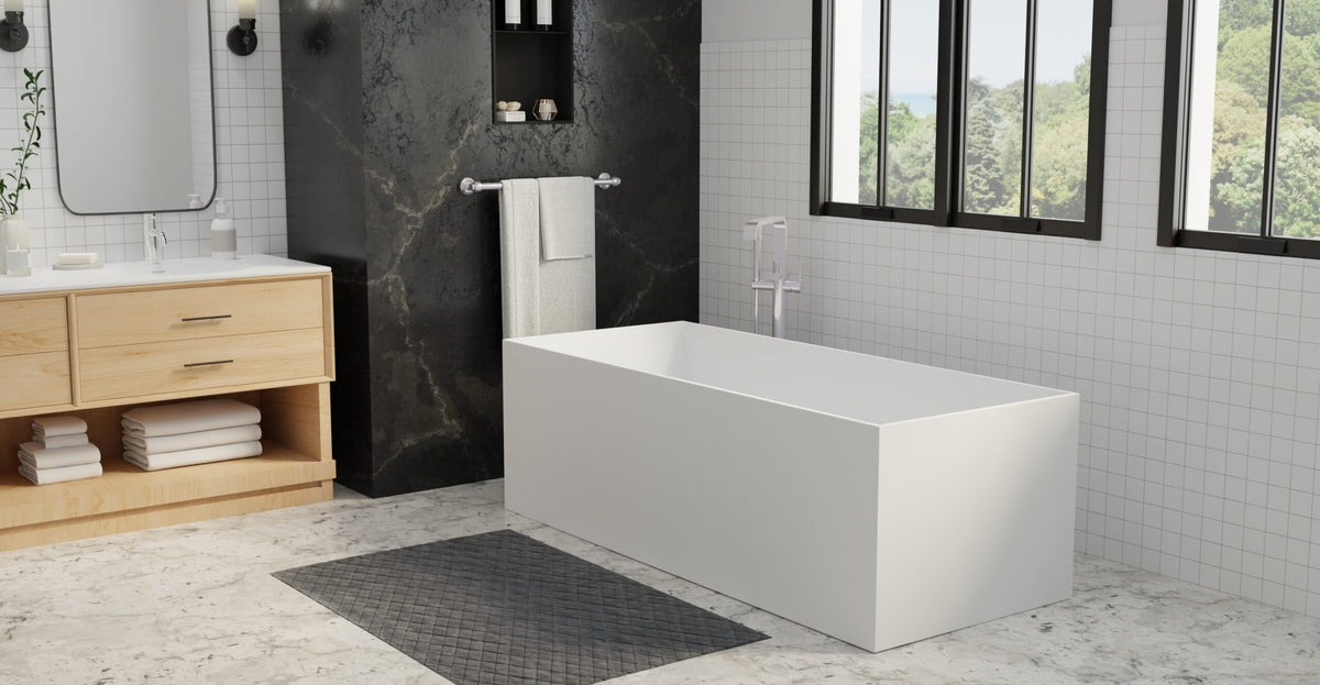 Rectangular freestanding tub beside a separate stone-walled shower area and a wood vanity