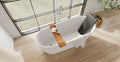 Badeloft BR-01 matte black bathtub backrest installed in a white freestanding tub, overhead bathroom view