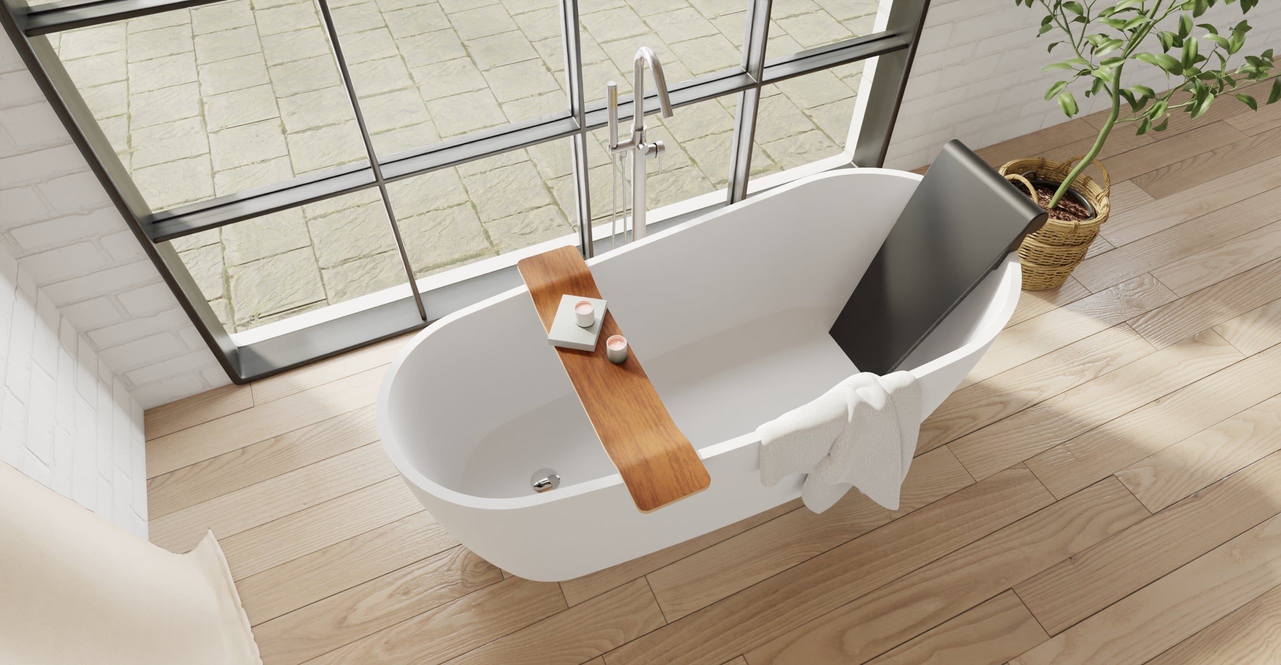 Badeloft BR-01 matte black bathtub backrest installed in a white freestanding tub, overhead bathroom view