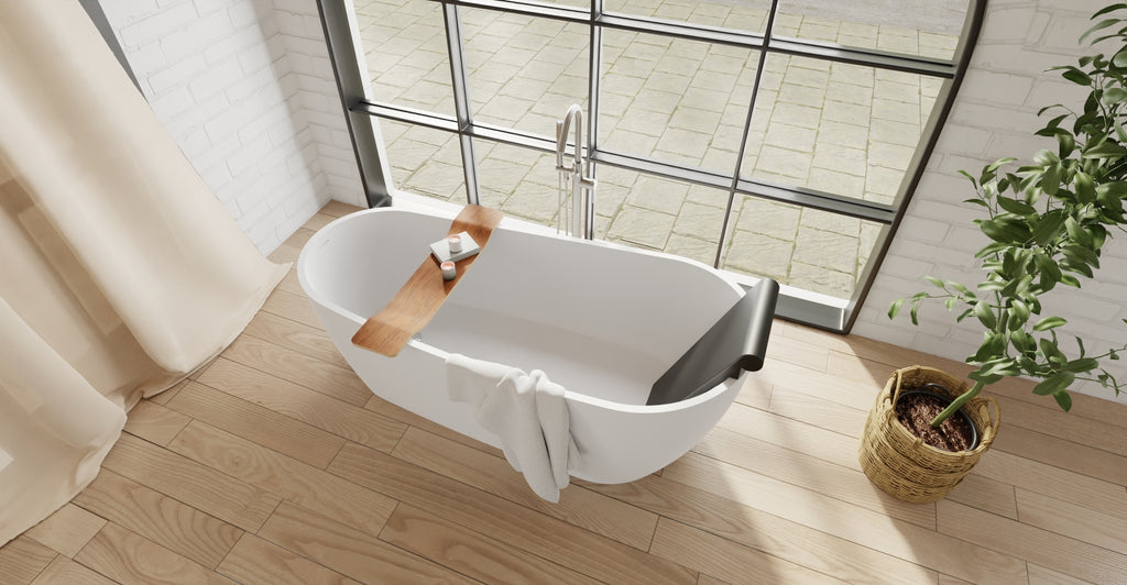 Badeloft BR-01 matte black bathtub backrest installed in a white freestanding tub, angled overhead view