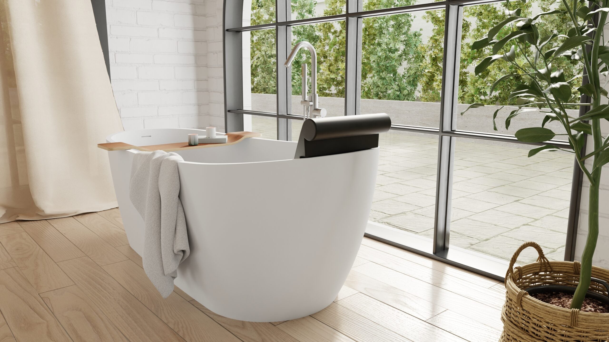 Badeloft BR-01 matte black bathtub backrest installed in a white freestanding tub, bright side view