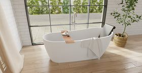 Badeloft BR-01 matte black bathtub backrest installed in a white freestanding tub, wide bathroom view