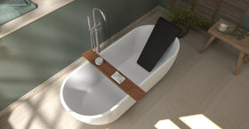 Badeloft BR-01 matte black bathtub backrest installed in a white freestanding tub, overhead green bathroom view