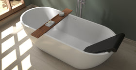 Badeloft BR-01 matte black bathtub backrest installed in a white freestanding tub, close angled view