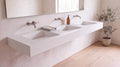 90" ADA Triple Ramp Sink, Wall Mounted in matte white stone resin, wall mounted in a bright bathroom