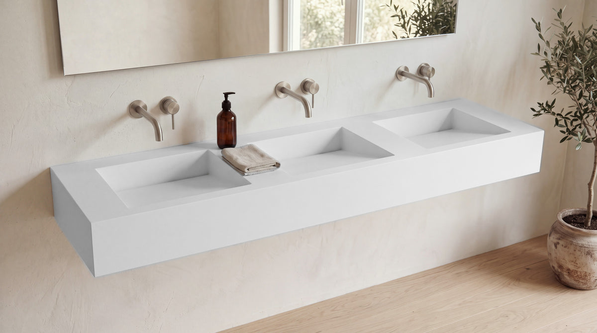 84" ADA Triple Ramp Sink, Wall Mounted in matte white stone resin, wall mounted in a bright bathroom