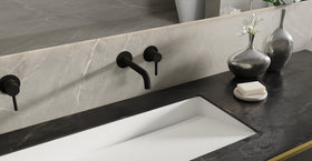 Badeloft WAT-02 matte black sink faucet, lifestyle view, etched handle cap