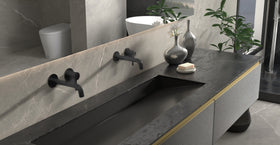 Badeloft WAT-02 matte black sink faucet, lifestyle side view, etched handle cap