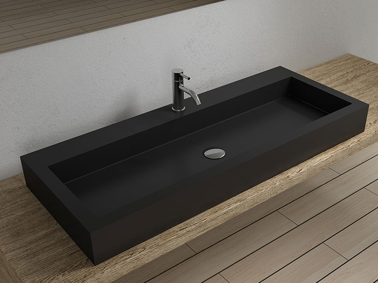 Badeloft WB-05-XXL countertop sink in black on a light wood counter with a deck-mounted faucet