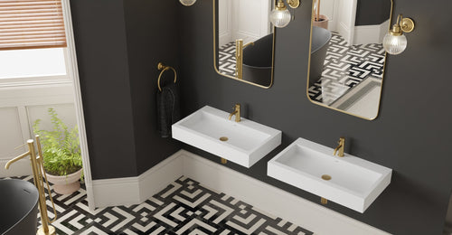 Two Badeloft WT-06-L wall-mounted sinks in matte white on a dark wall with two arched mirrors above a patterned tile floor