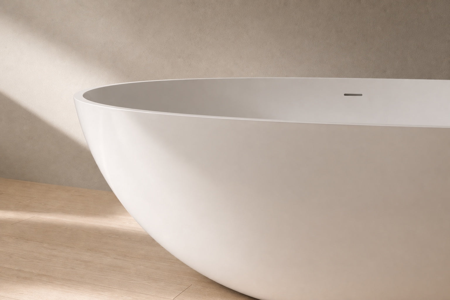 Close view of the substantial curved wall and rim of a glossy white BW-01-XL bathtub
